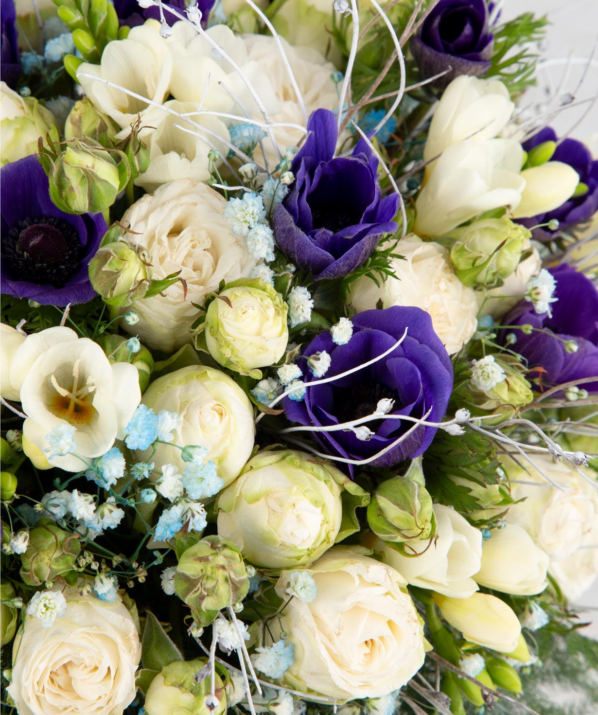 Arrangement `Achinsk` with spray roses and freesias