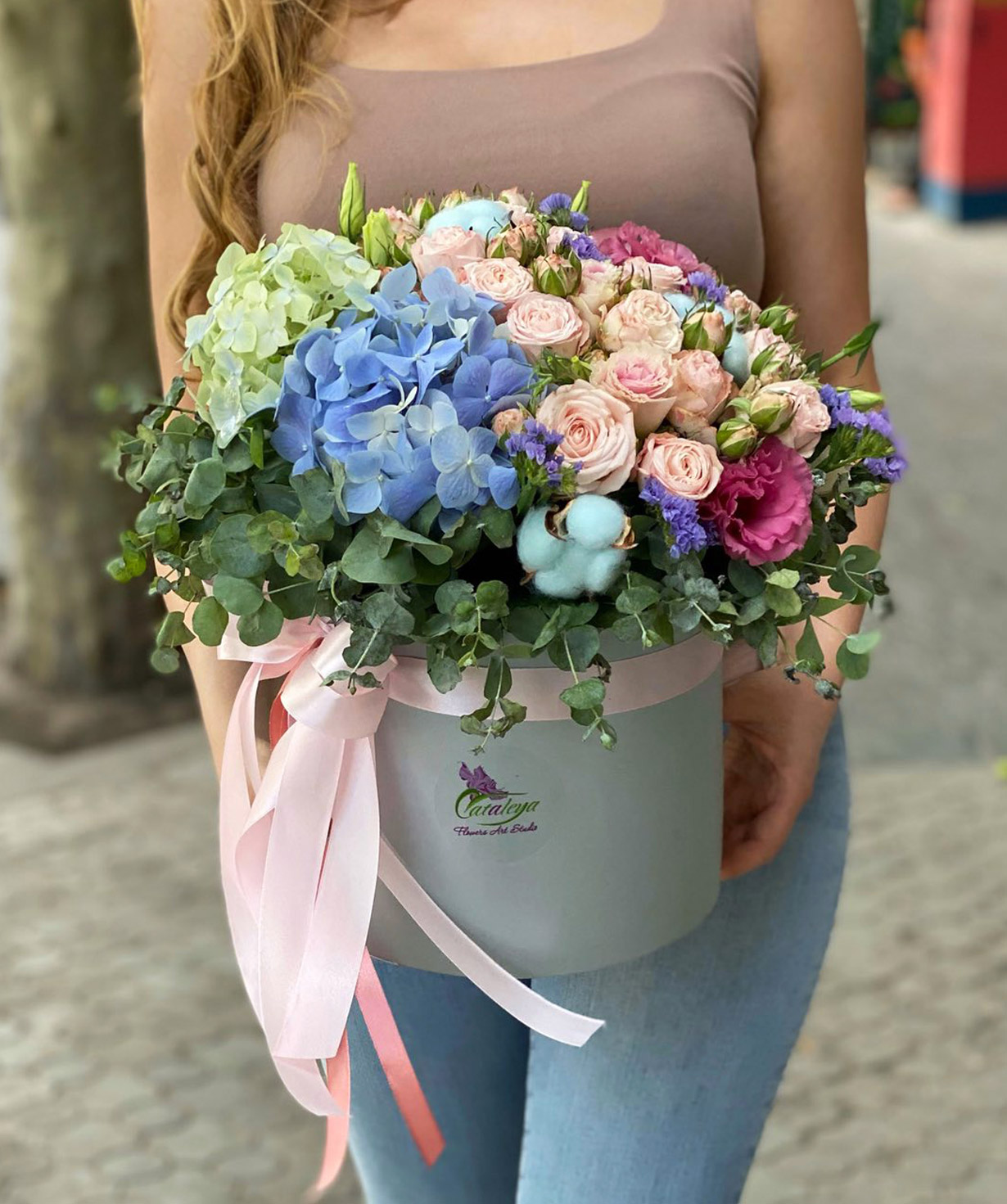 Composition `Kondrovo` with spray roses and lisianthus