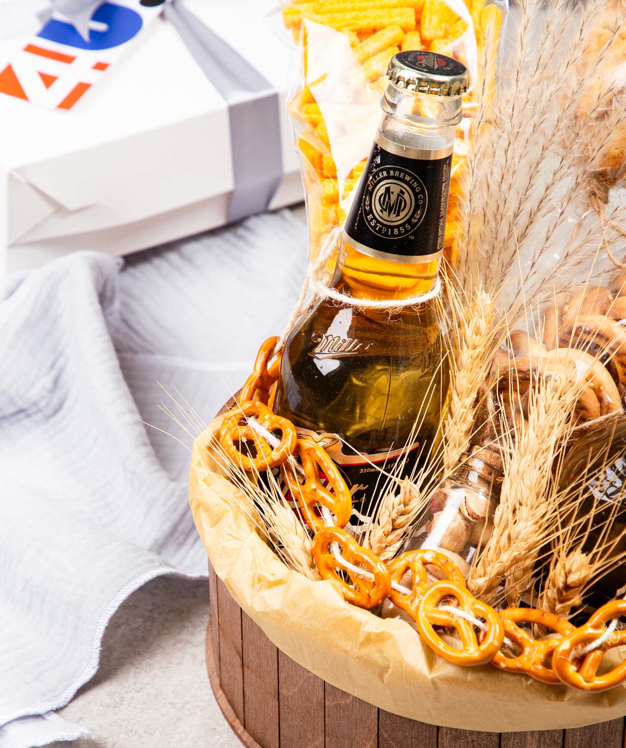 Tasty composition «THE BOX» with beers and nuts