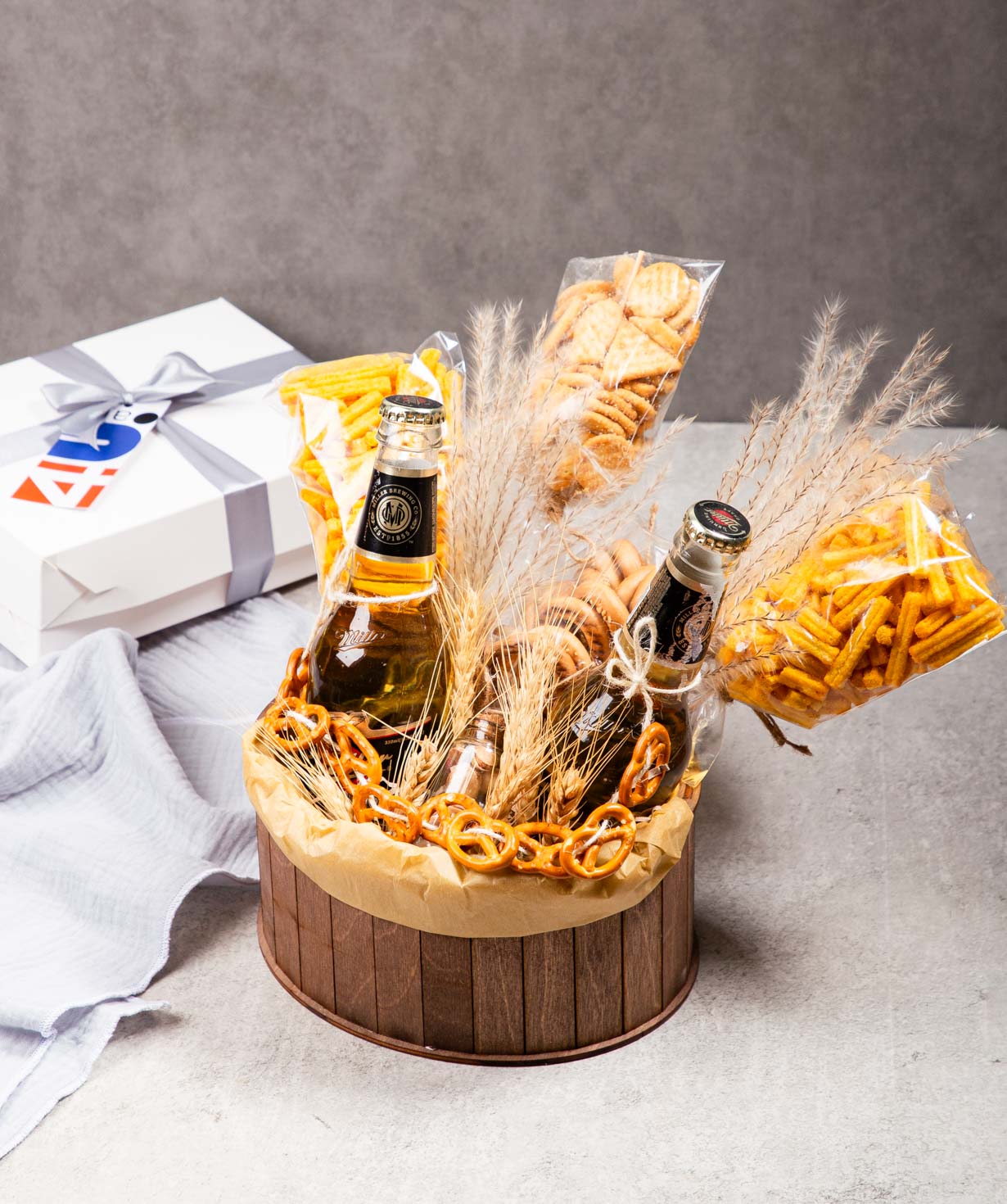 Tasty composition «THE BOX» with beers and nuts