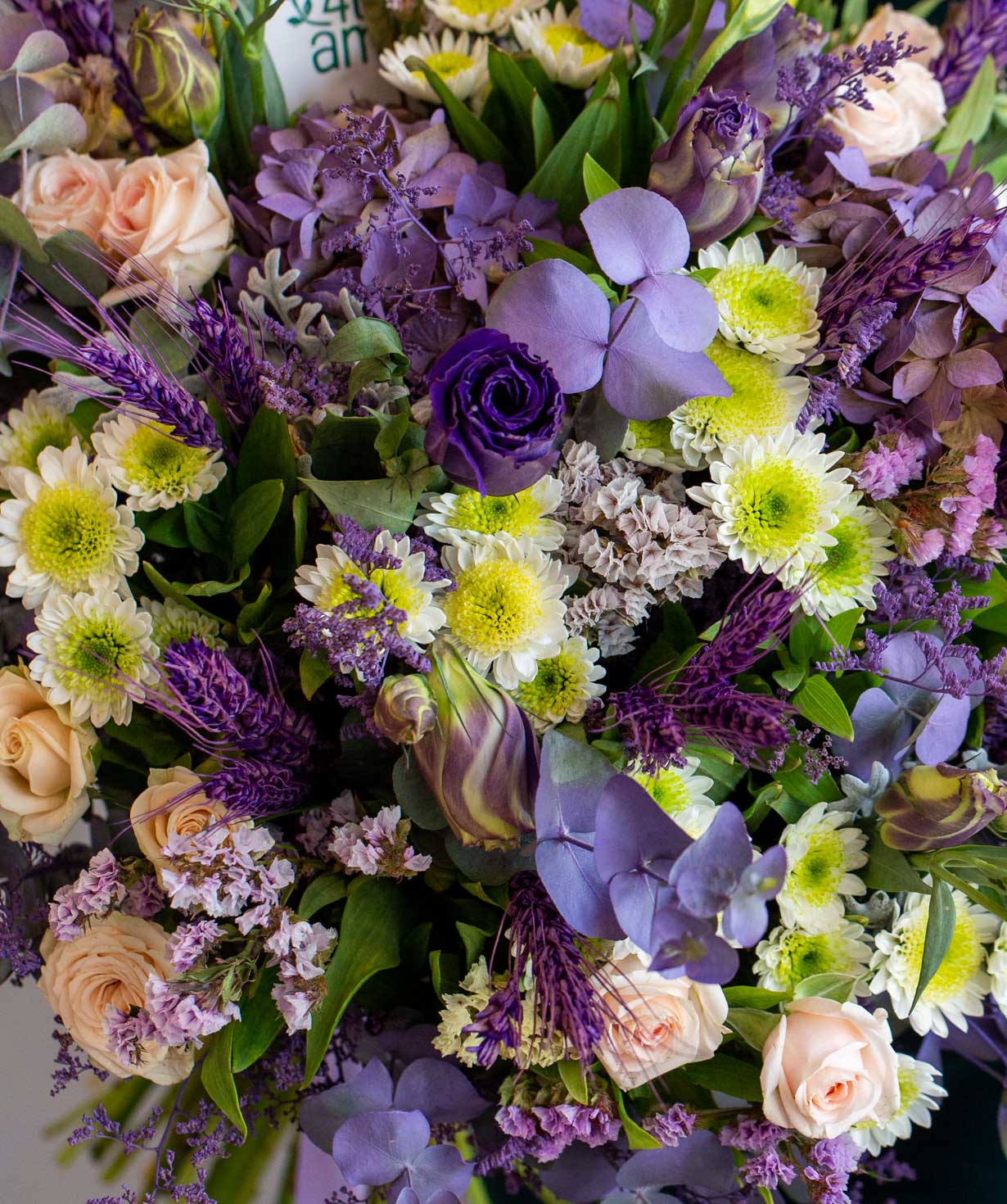 Bouquet `Banff` with roses, lisianthus and chrysanthemums